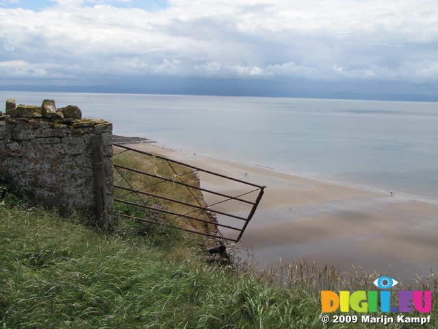 SX06717 Rusty fence at the edge of the cliffs